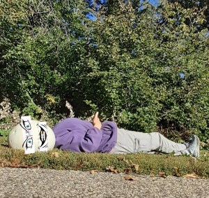 Bizarre picture of a person reclining, puffball mushroom face