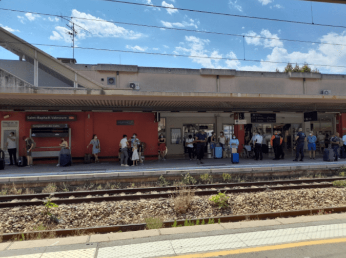 Outside train station in summer, no train arrived yet